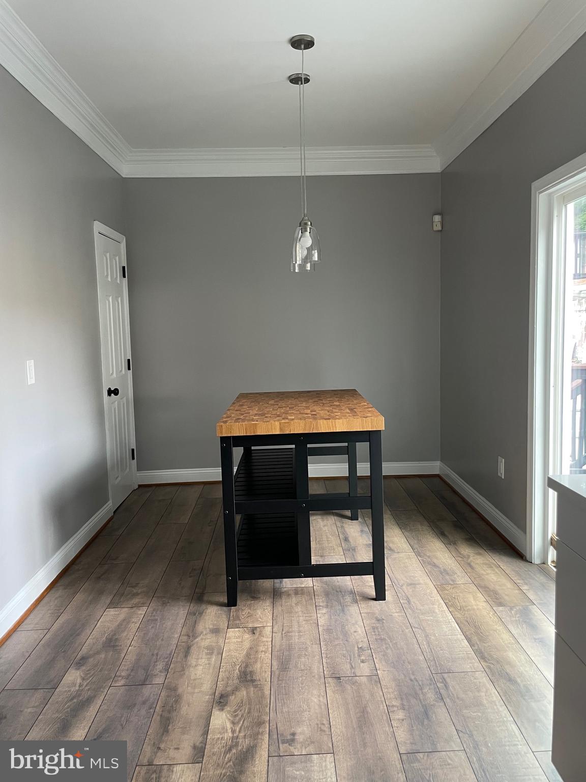 2403 Garrison Boulevard Baltimore, MD 21216 - Photo 8 of 34 a room with wooden floor and furniture