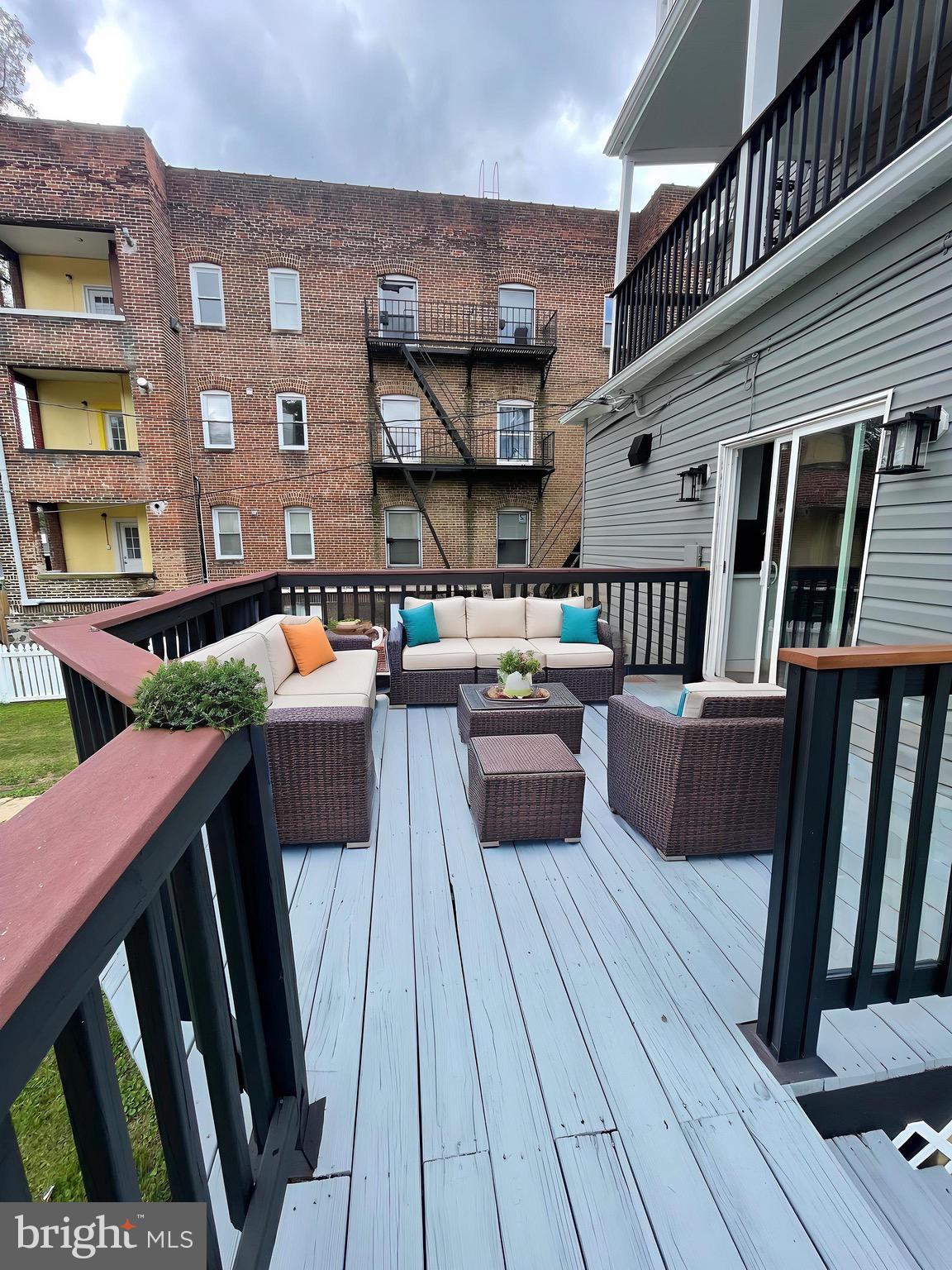 2403 Garrison Boulevard Baltimore, MD 21216 - Photo 10 of 34 a living room with furniture wooden floor and a fireplace