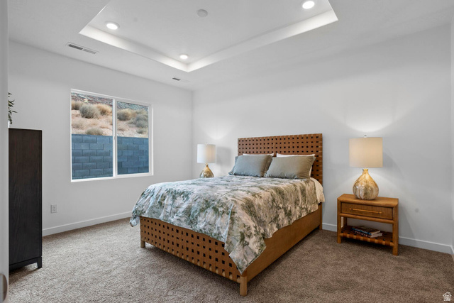 1624 South Staircase Way, Unit 4183 Washington, UT 84780 - Photo 13 of 47 Recessed ceiling lighting, tray ceiling, and a large window with desert landscaping and a block wall
