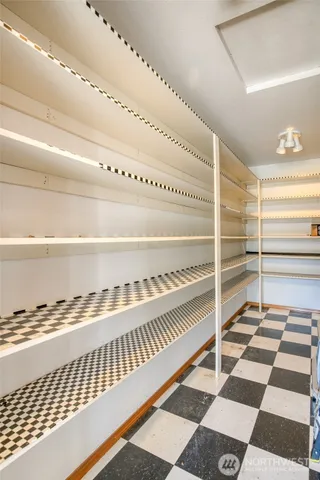 a view of a bedroom with a balcony and a ceiling fan