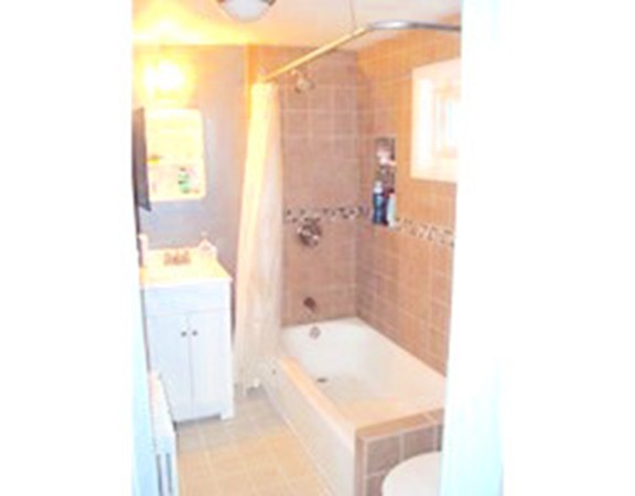 12 Byron Road Natick, MA 01760 - Photo 11 of 14 a bathroom with a tub shower and sink