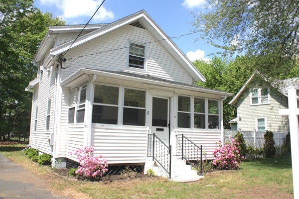 12 Byron Road Natick, MA 01760 - Photo 2 of 14 a front view of a house with a yard