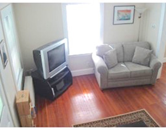 12 Byron Road Natick, MA 01760 - Photo 5 of 14 a living room with furniture and a flat screen tv