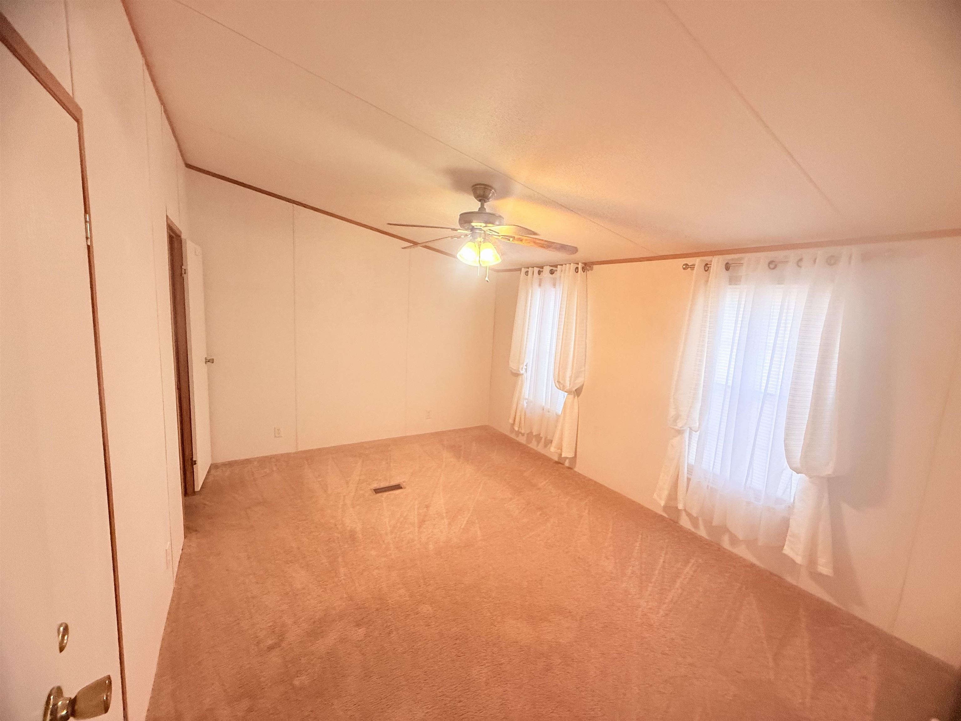 5 Buccaneer Street Murrells Inlet, SC 29576 - Photo 13 of 30 Empty room featuring carpet flooring and a ceiling fan