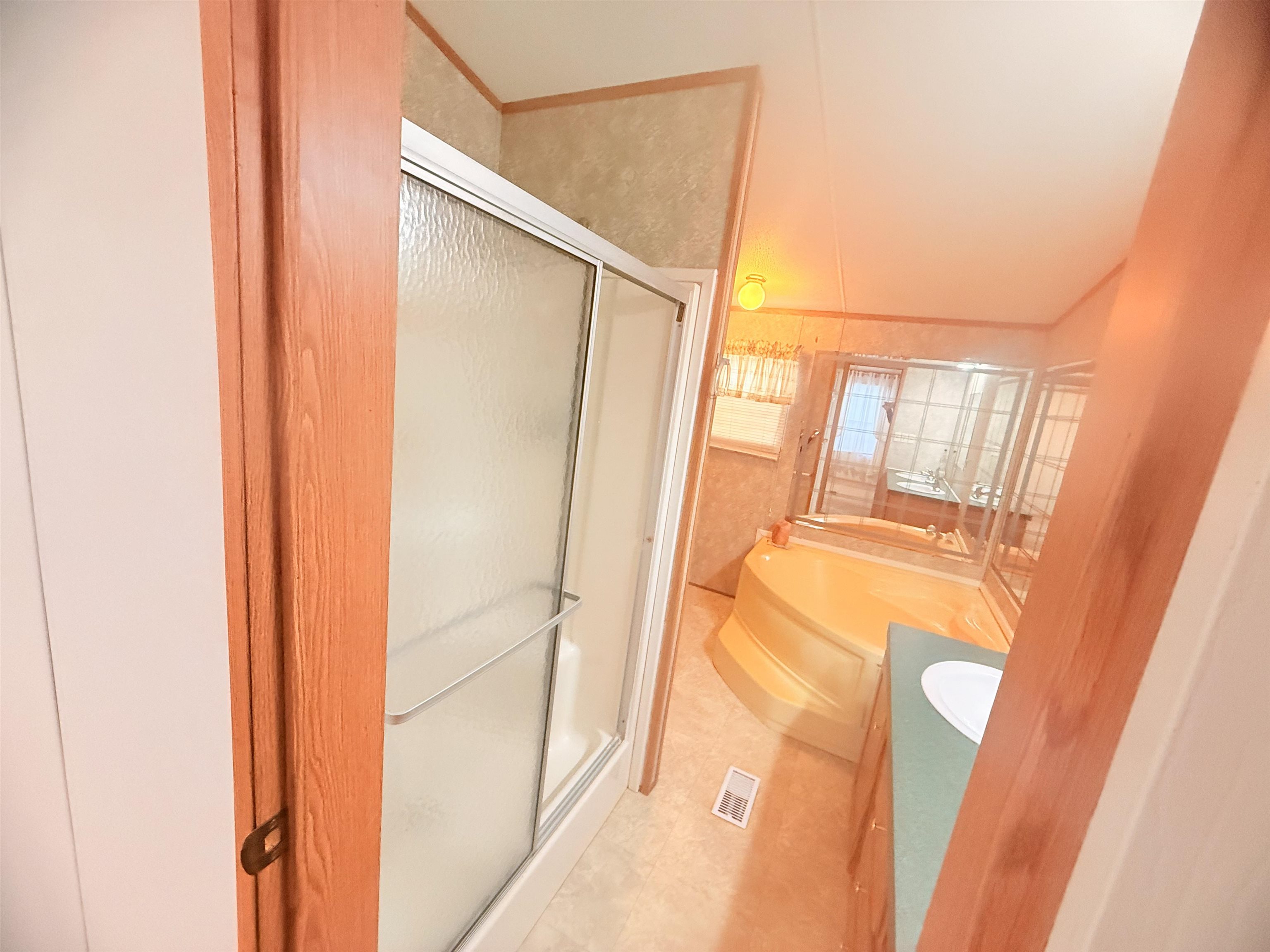 5 Buccaneer Street Murrells Inlet, SC 29576 - Photo 15 of 30 Bathroom with vanity, a shower stall, and a bath