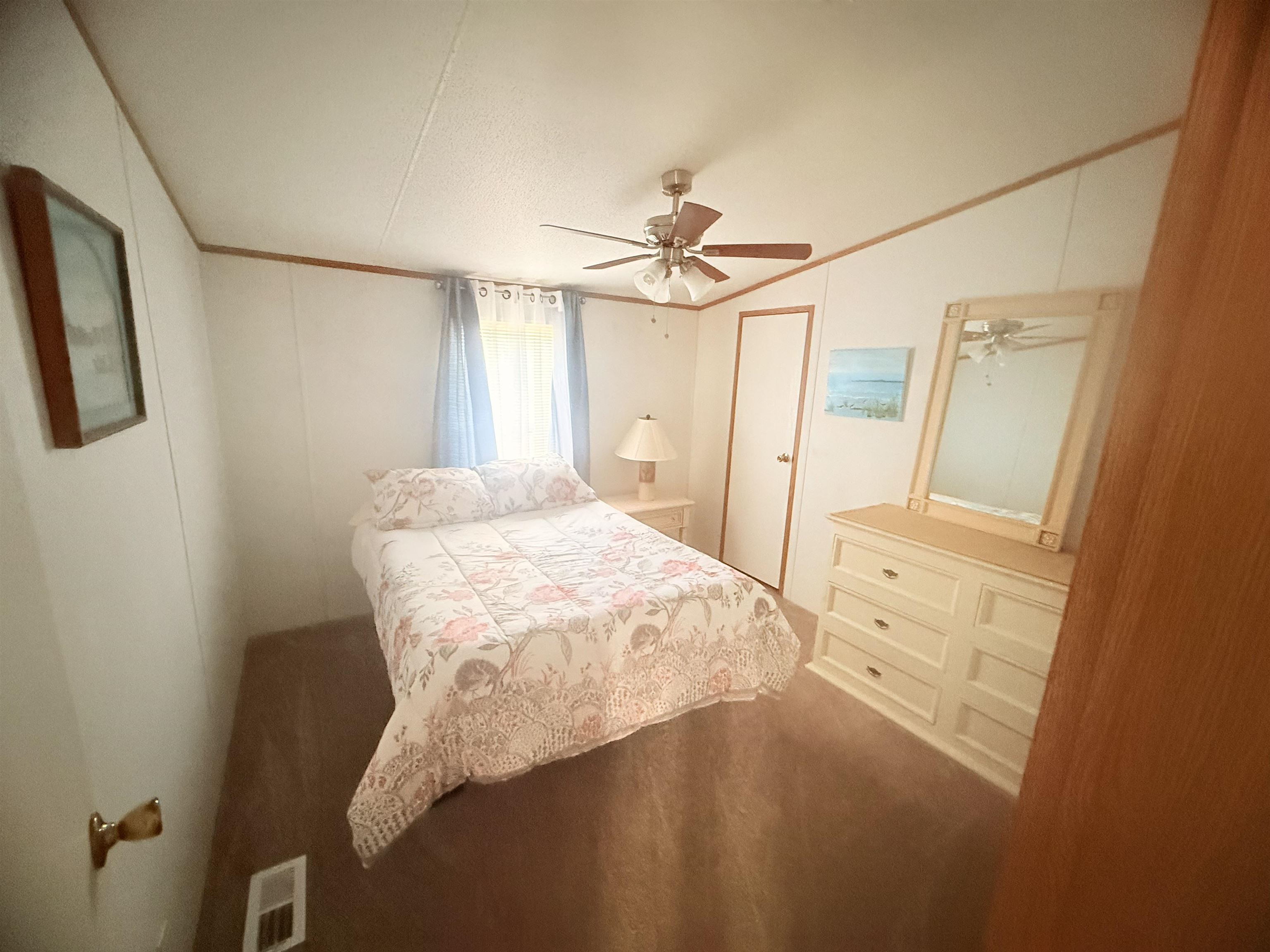 5 Buccaneer Street Murrells Inlet, SC 29576 - Photo 18 of 30 Carpeted bedroom featuring ceiling fan, crown molding, and vaulted ceiling