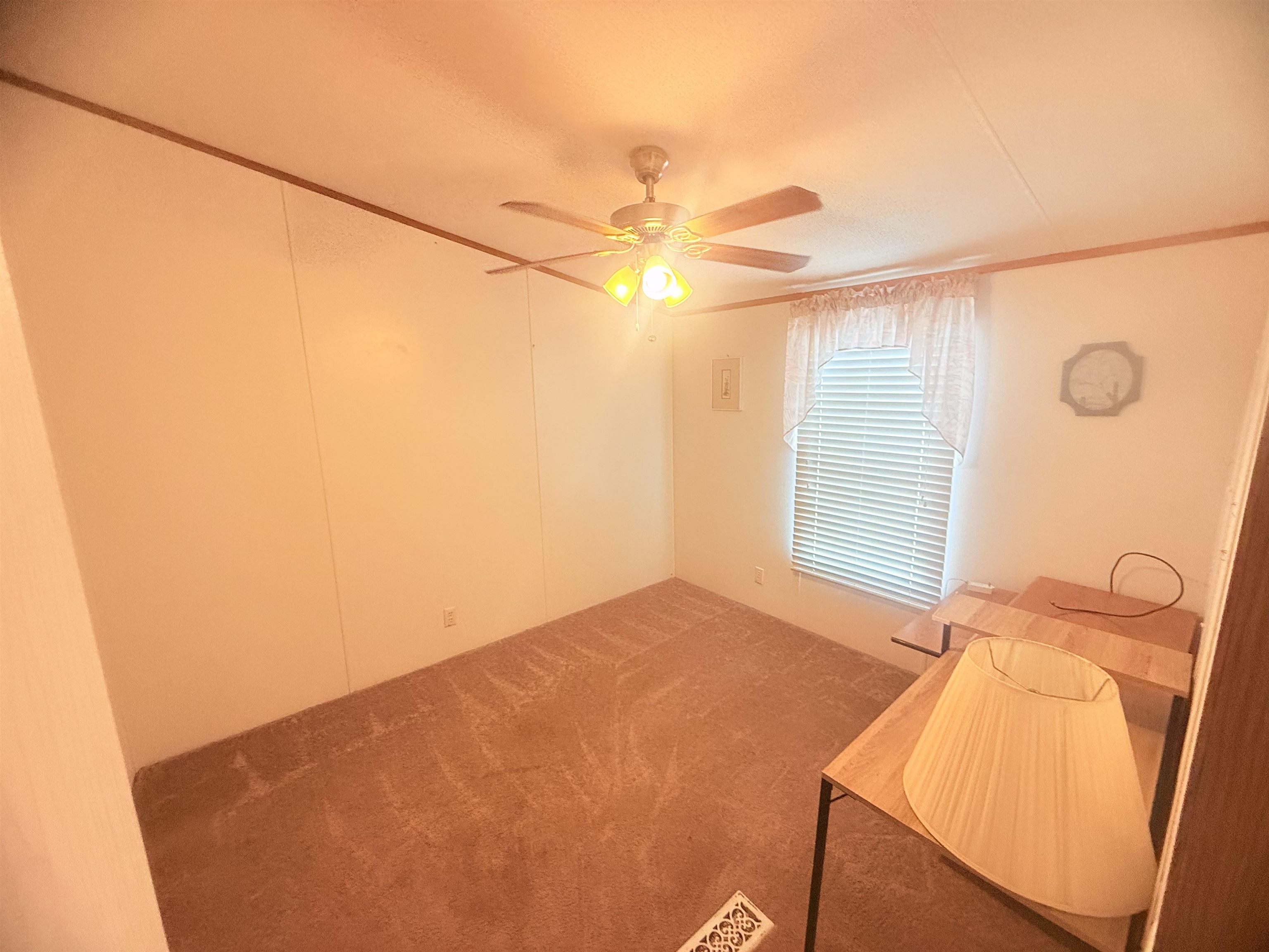 5 Buccaneer Street Murrells Inlet, SC 29576 - Photo 19 of 30 Unfurnished bedroom featuring crown molding, ceiling fan, and carpet floors