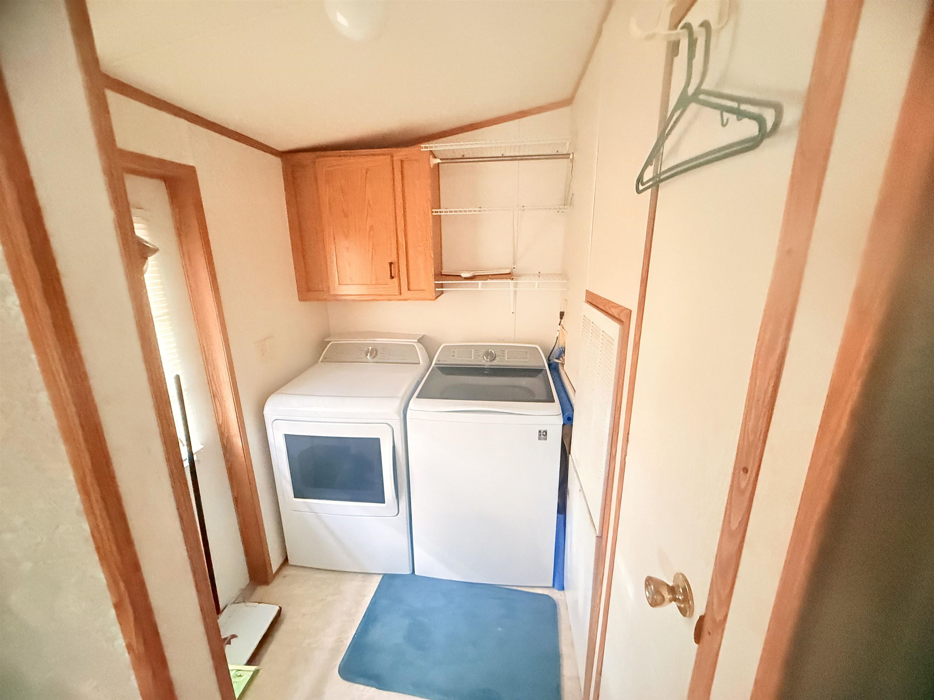 5 Buccaneer Street Murrells Inlet, SC 29576 - Photo 22 of 30 Laundry room featuring cabinet space and washing machine and clothes dryer
