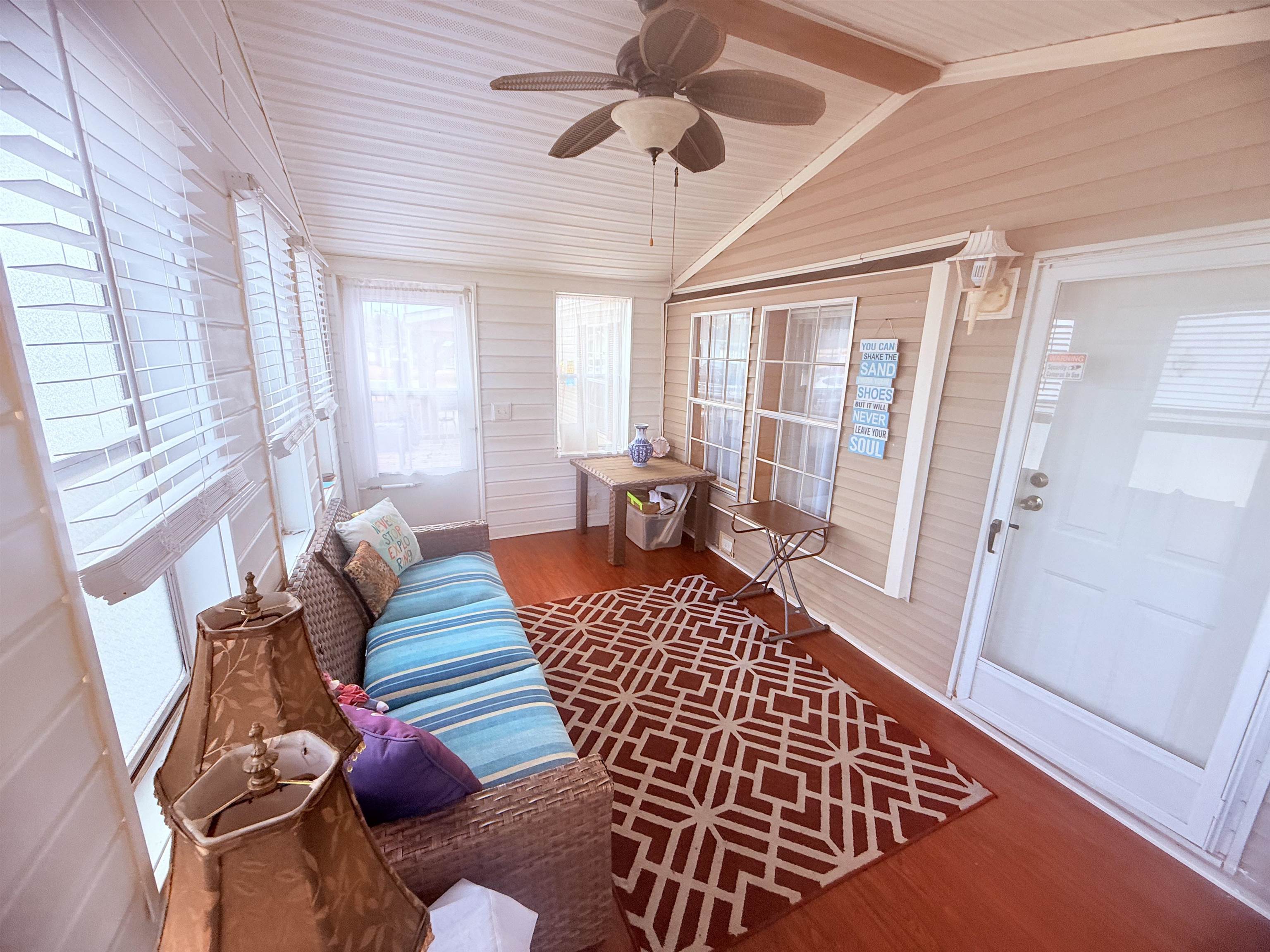 5 Buccaneer Street Murrells Inlet, SC 29576 - Photo 6 of 30 Sunroom / solarium featuring wood finished floors, wood ceiling, plenty of natural light, and wood walls