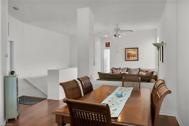 a living room with furniture window and wooden floor