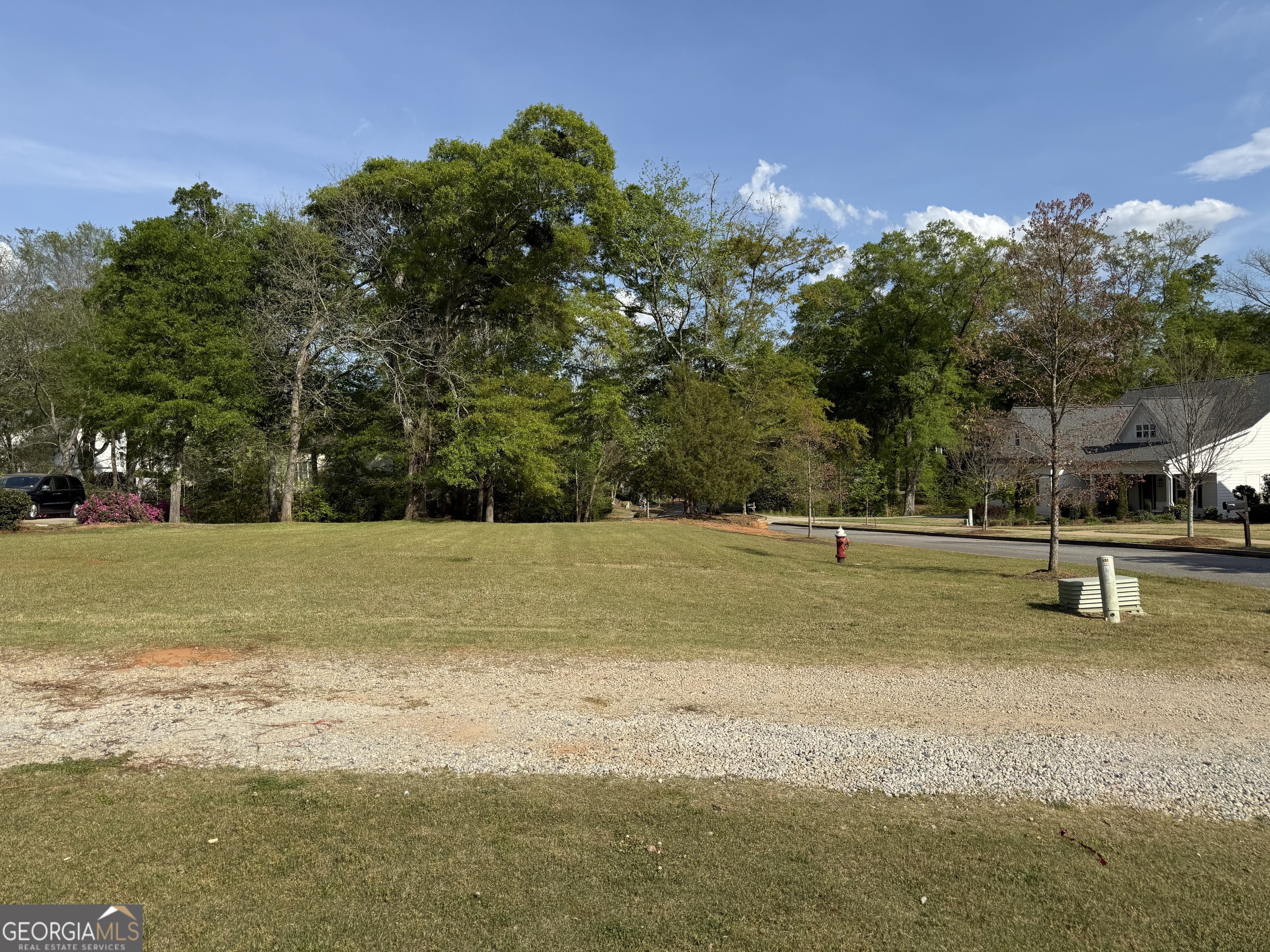 533 Village Road Madison, GA 30650 - Photo 2 of 6 a view of a swimming pool with a yard