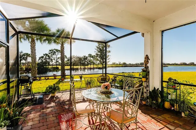 a view of a swimming pool with a table and chairs