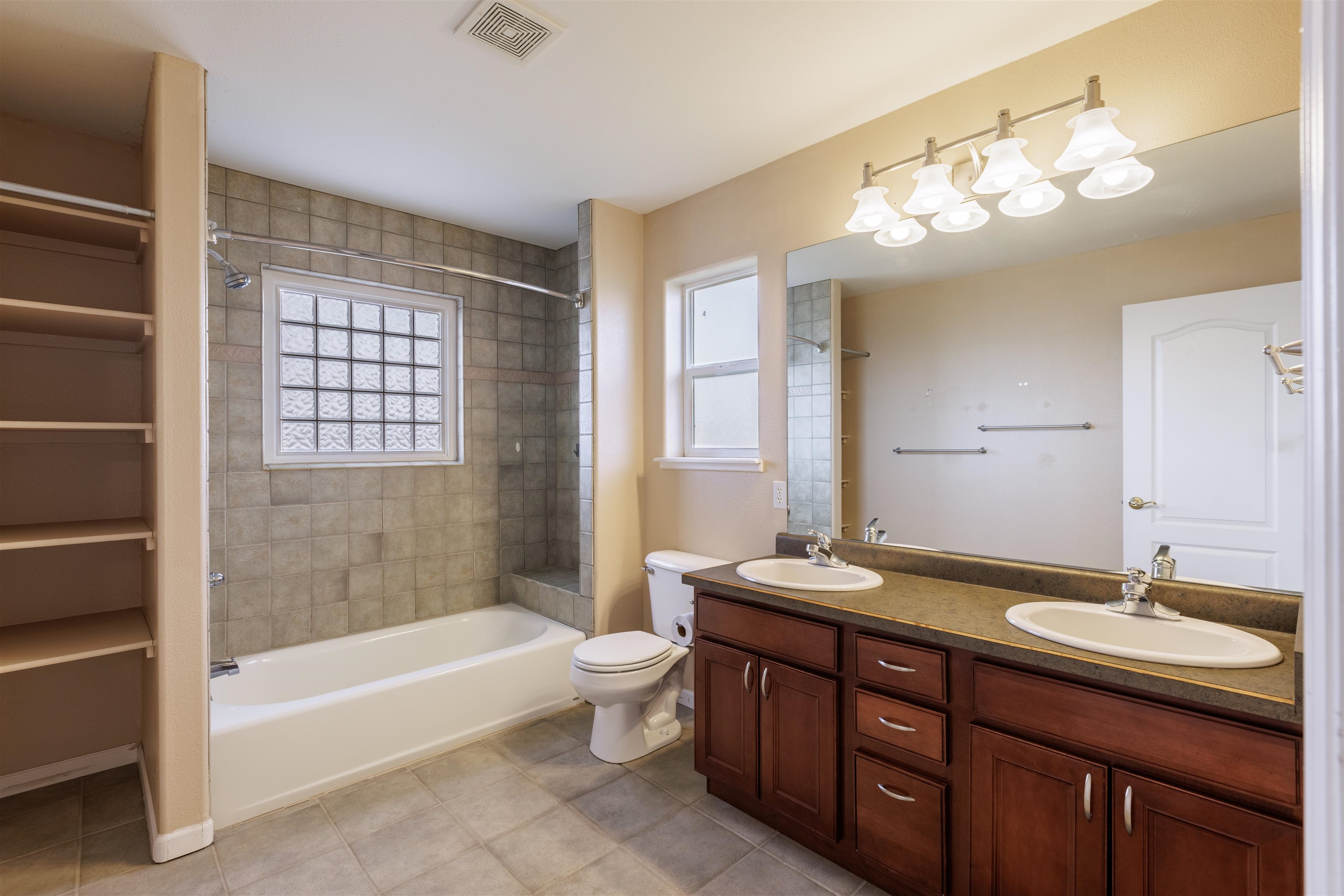 2098 J Road Fruita, CO 81521 - Photo 8 of 13 a bathroom with a tub double sink shower and a mirror