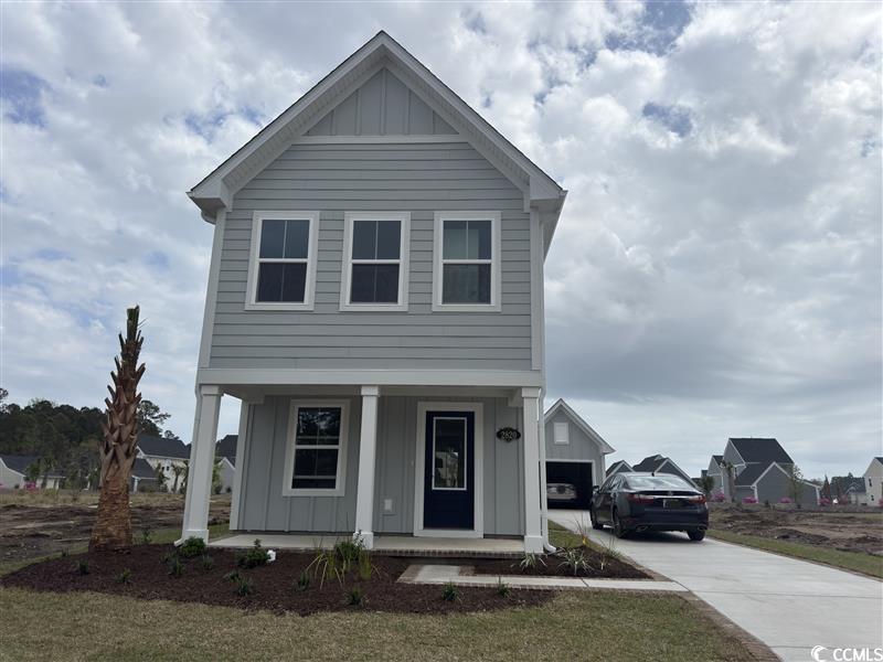 2820 Rowyn Street Longs, SC 29568 - Photo 1 of 1 View of front of home with driveway, board and bat
