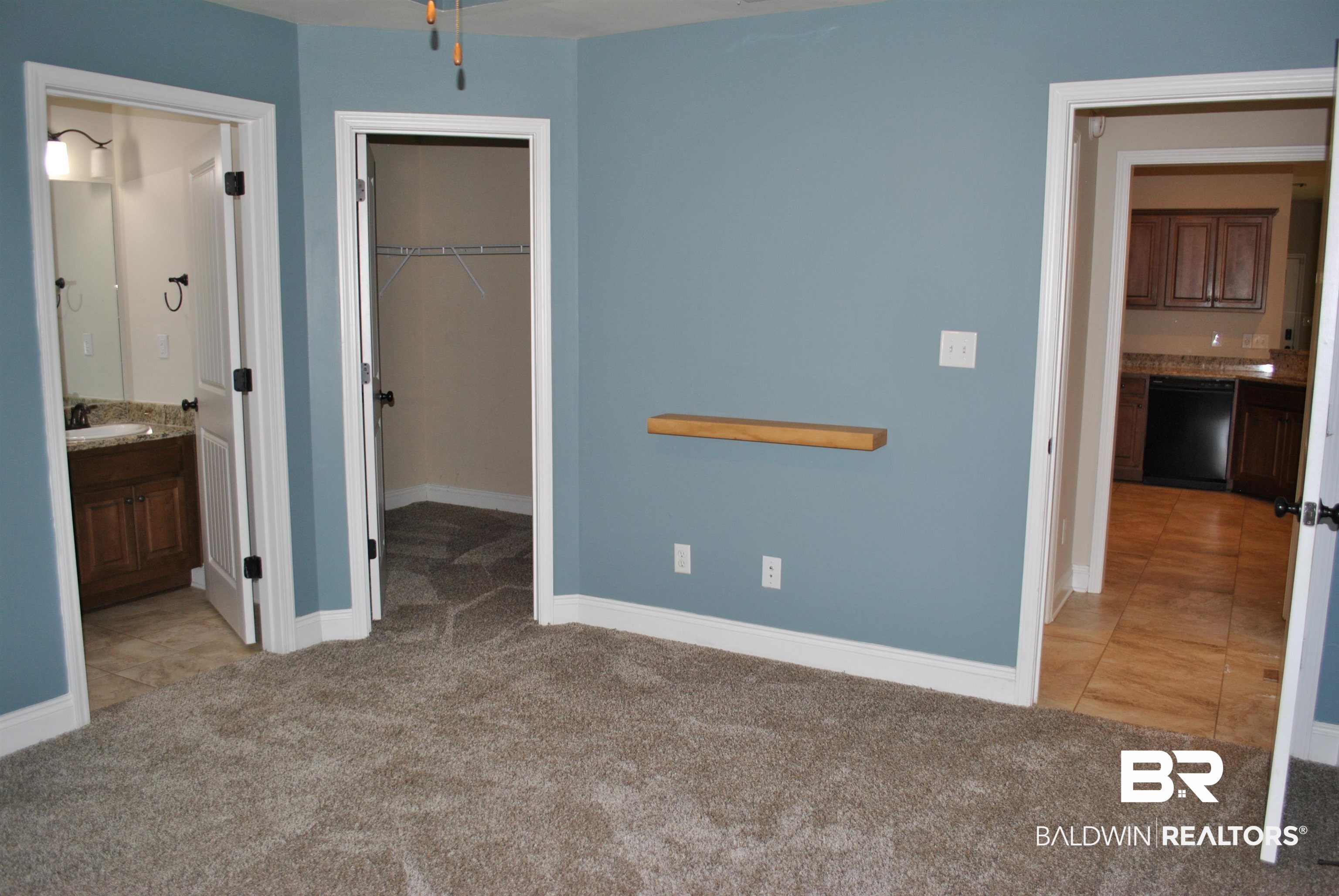 2161 Spring Grove West Mobile, AL 36695 - Photo 19 of 31 Unfurnished bedroom with light carpet, a walk in closet, a closet, and ensuite bath