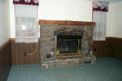Lesh Road Sciota, PA 18354 - Photo 3 of 7 a living room with furniture and a fireplace