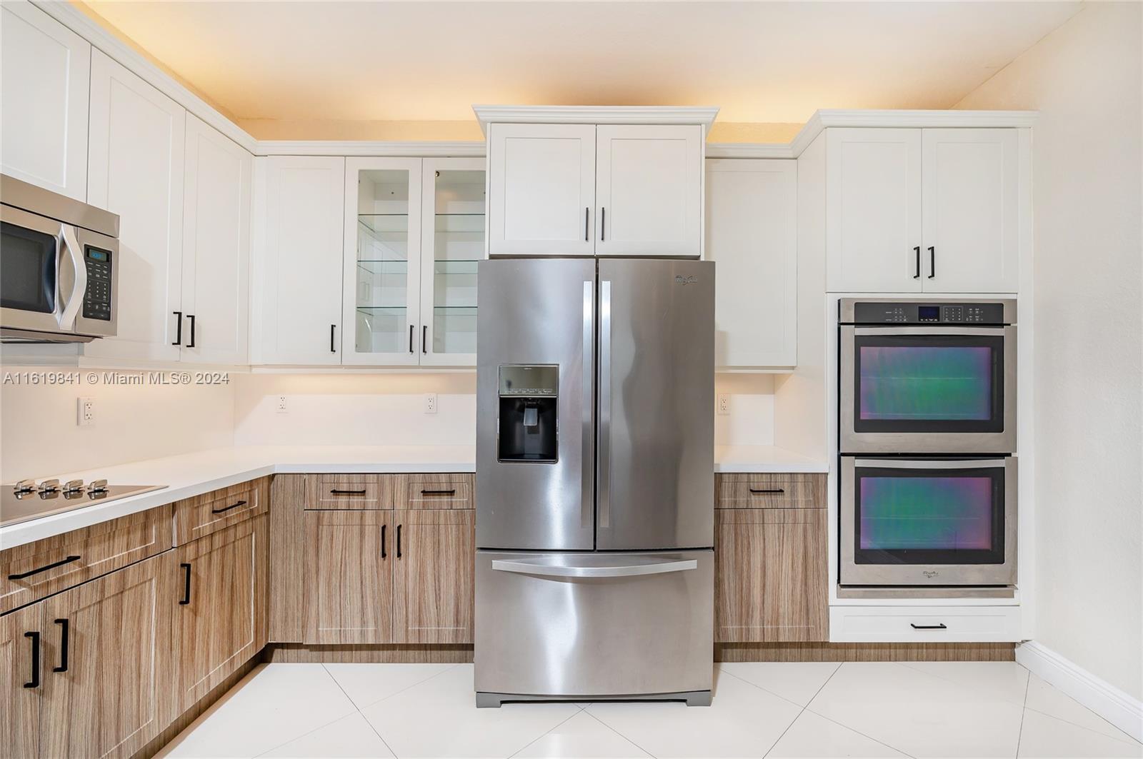 4136 Southwest 179th Way Miramar, FL 33029 - Photo 12 of 42 a kitchen with stainless steel appliances a refrigerator stove and microwave