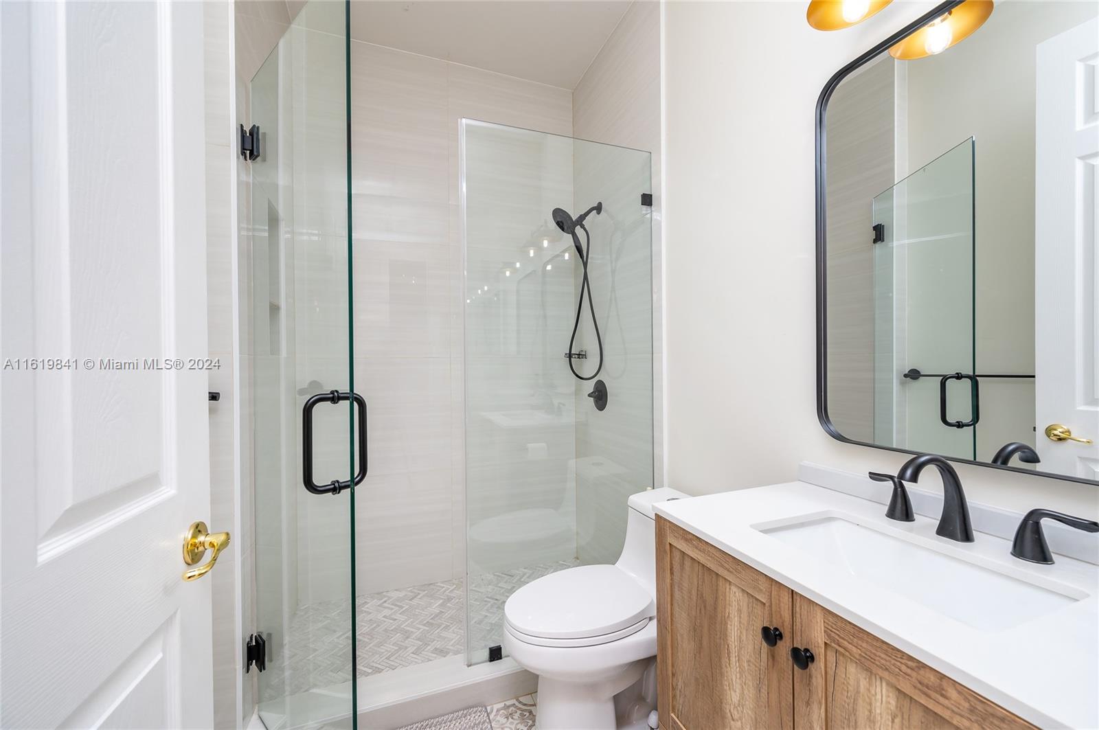 4136 Southwest 179th Way Miramar, FL 33029 - Photo 19 of 42 a bathroom with a granite countertop sink toilet and shower