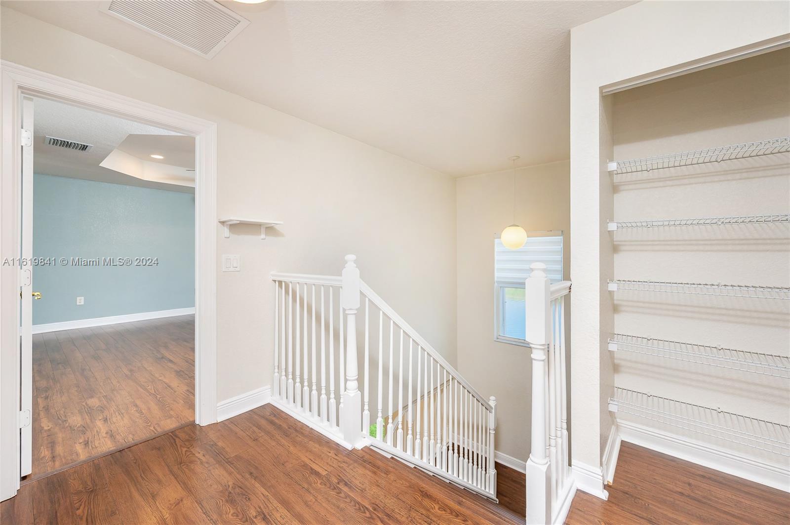 4136 Southwest 179th Way Miramar, FL 33029 - Photo 20 of 42 a view of a hallway with wooden floor and entryway