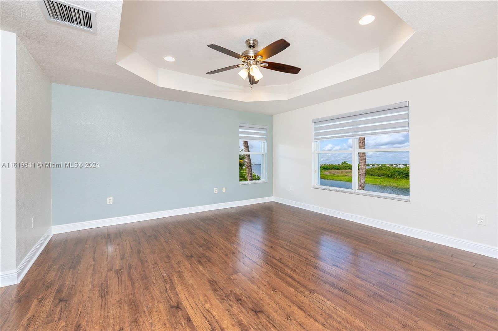 4136 Southwest 179th Way Miramar, FL 33029 - Photo 21 of 42 a view of an empty room with wooden floor and a window