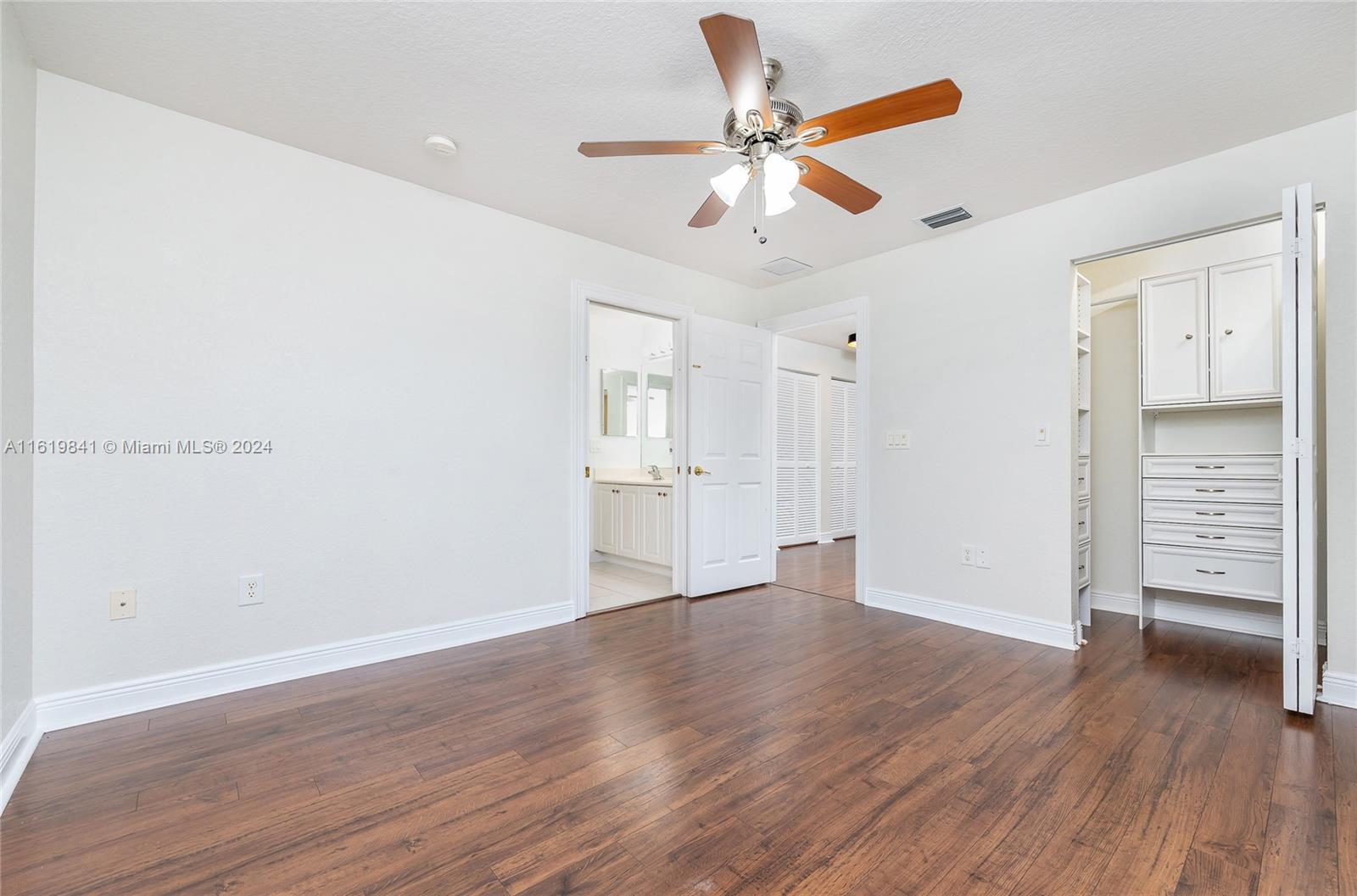 4136 Southwest 179th Way Miramar, FL 33029 - Photo 28 of 42 a view of an empty room with wooden floor