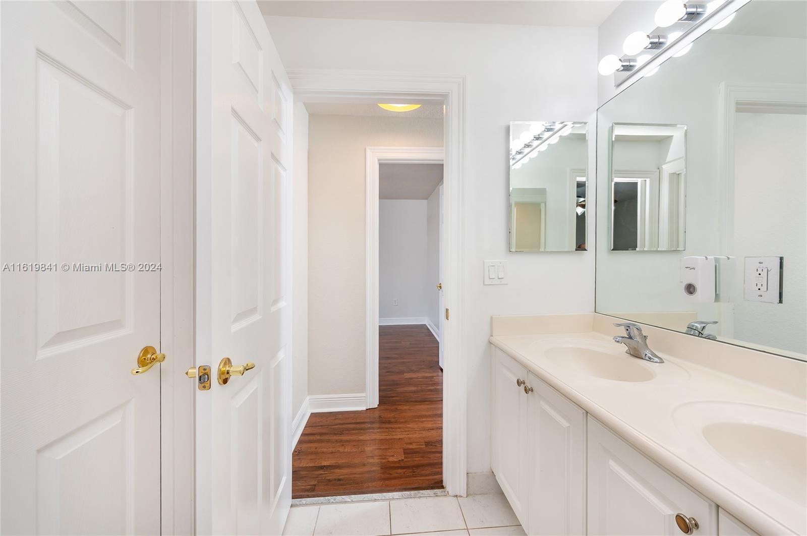 4136 Southwest 179th Way Miramar, FL 33029 - Photo 30 of 42 a bathroom with a sink a mirror and shower