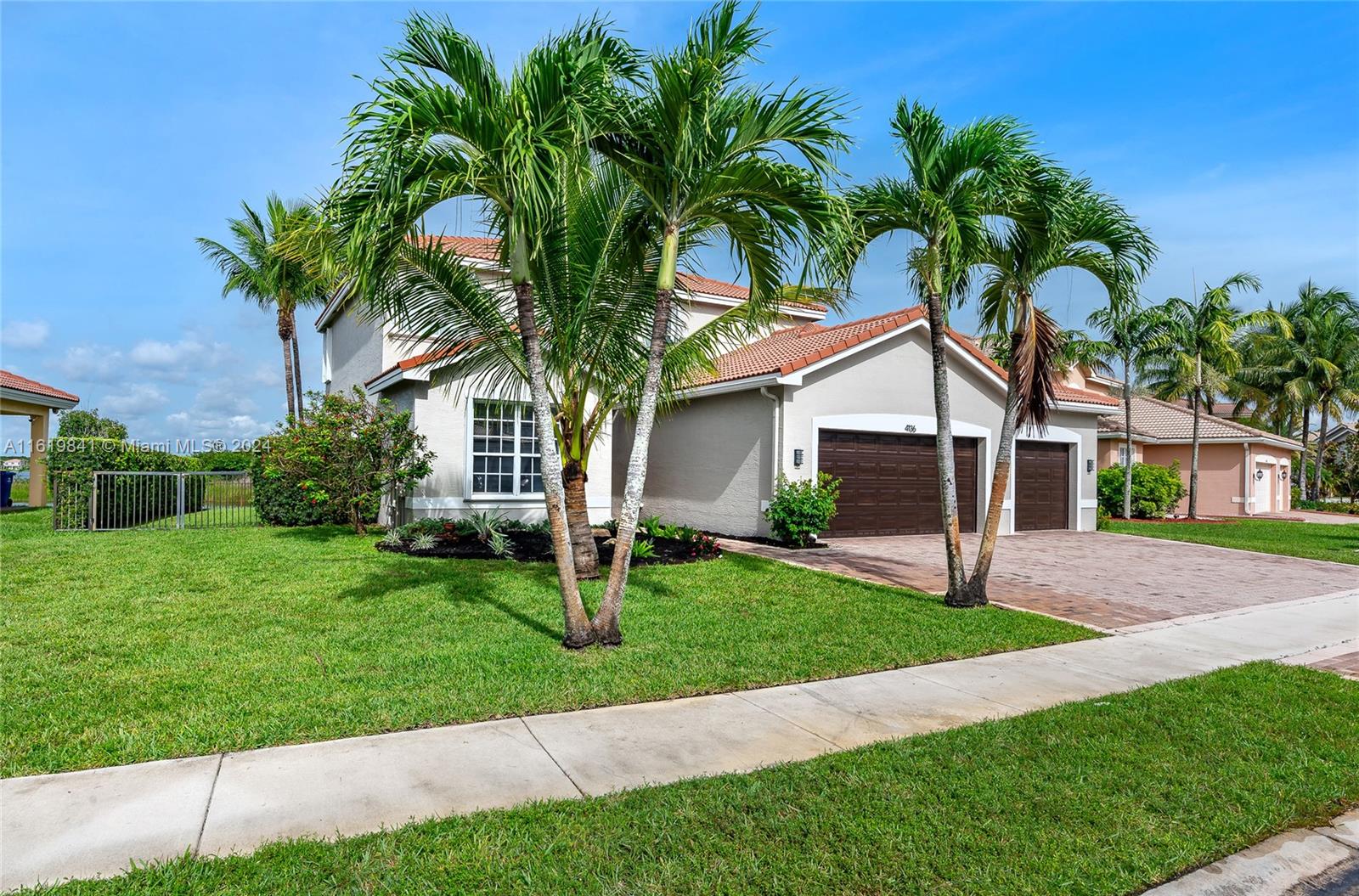 4136 Southwest 179th Way Miramar, FL 33029 - Photo 36 of 42 a front view of house with yard and green space