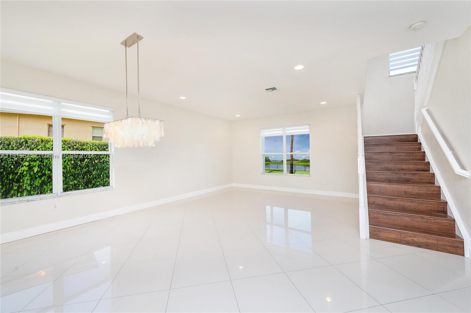 4136 Southwest 179th Way Miramar, FL 33029 - Photo 7 of 42 a view of a room with wooden floor and windows