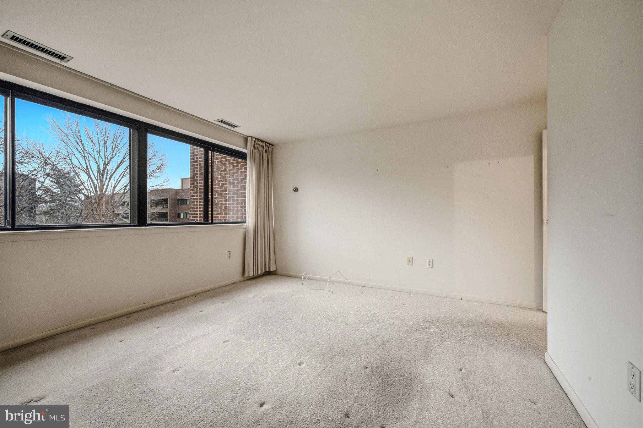 614 Loveville Road, Unit D5F Hockessin, DE 19707 - Photo 18 of 25 an empty room with large window