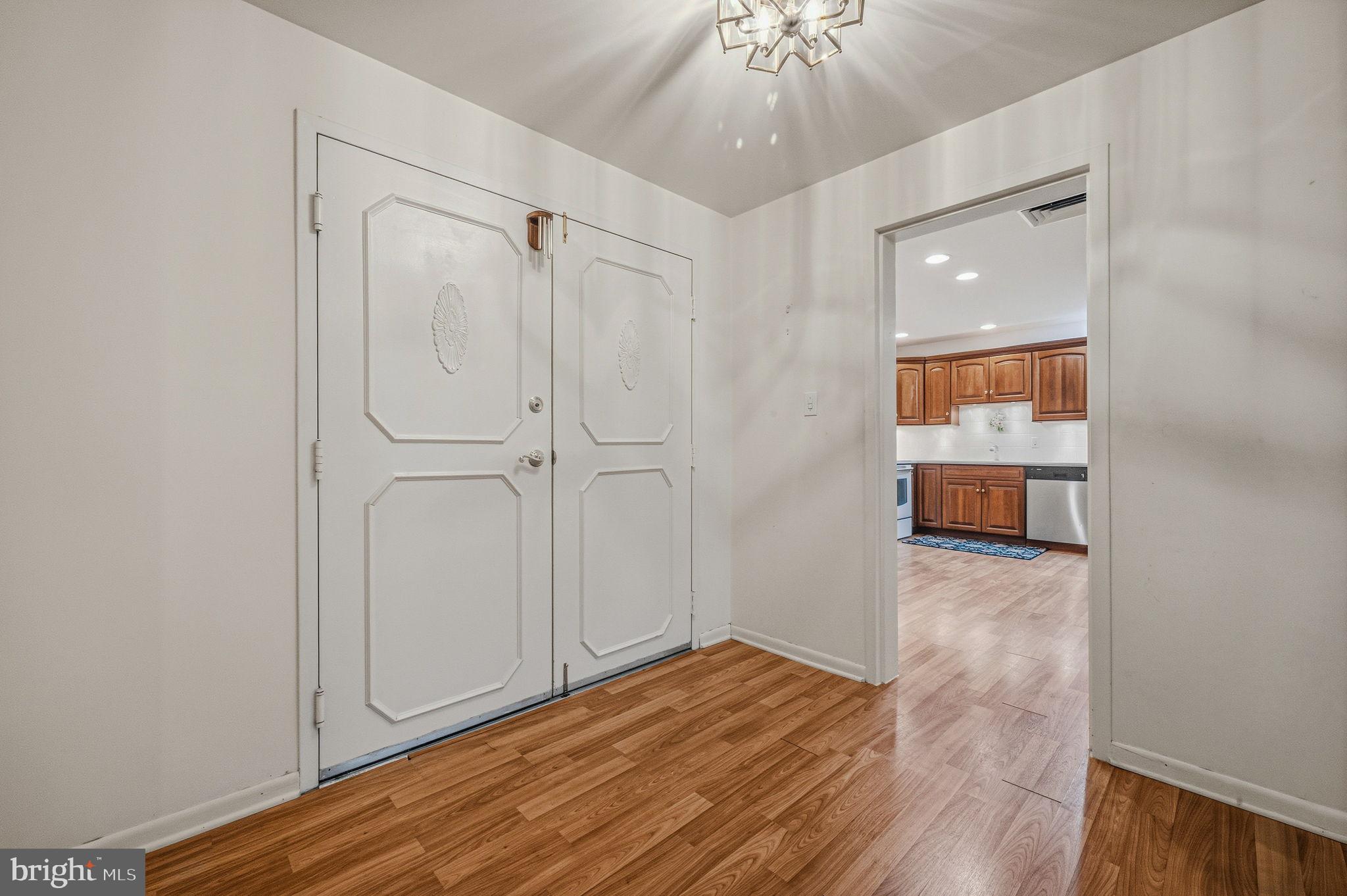 614 Loveville Road, Unit D5F Hockessin, DE 19707 - Photo 5 of 25 wooden floor in an empty room with a window