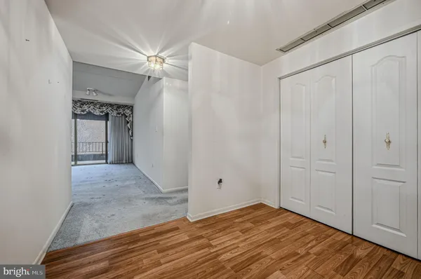 a view of a livingroom with wooden floor