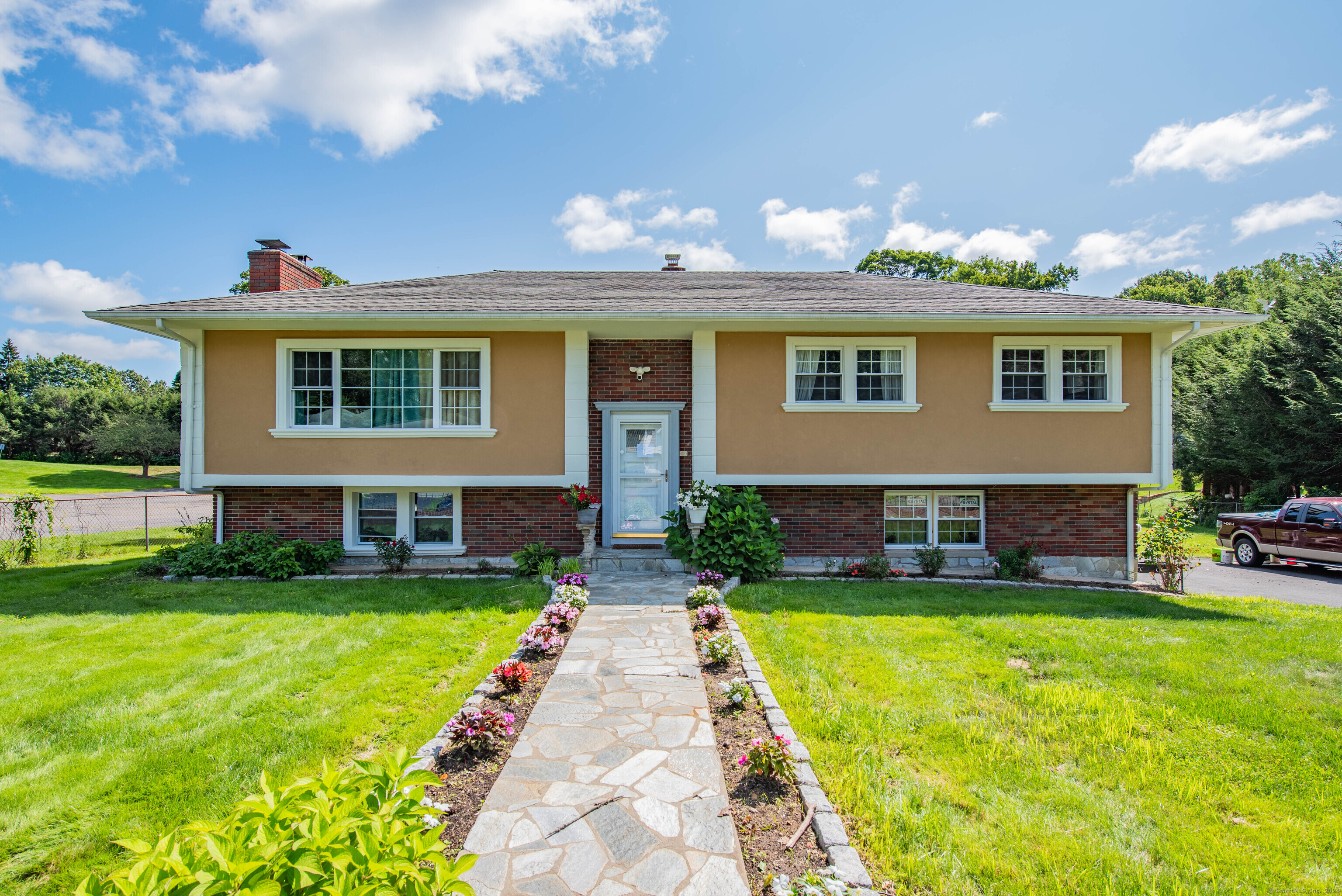 47 Ardsley Road Waterbury, CT 06708 - Photo 1 of 1 a front view of a house with a yard and porch