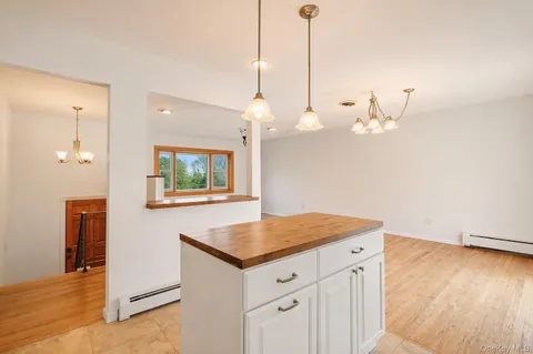 a kitchen with a table and chairs
