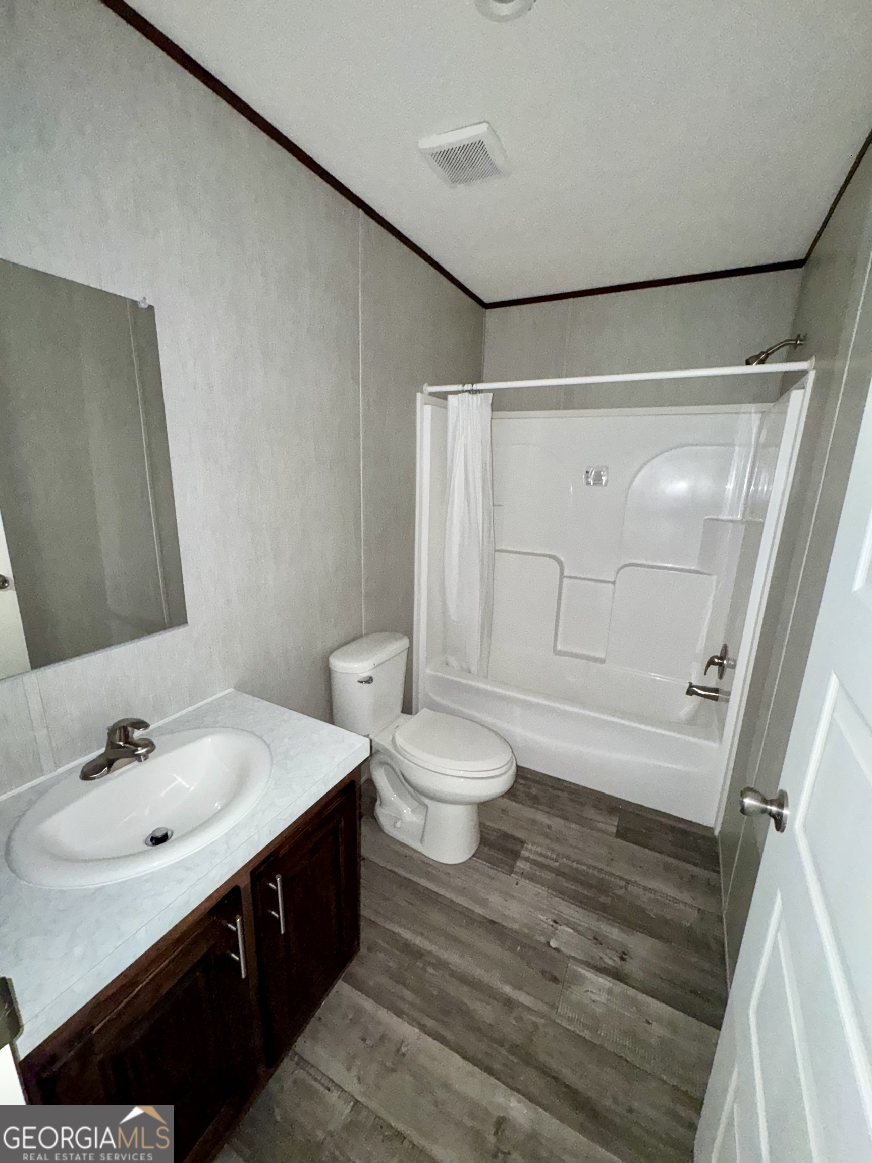 545 Ben Jackson Road Vidalia, GA 30474 - Photo 17 of 25 a bathroom with a sink a toilet and shower