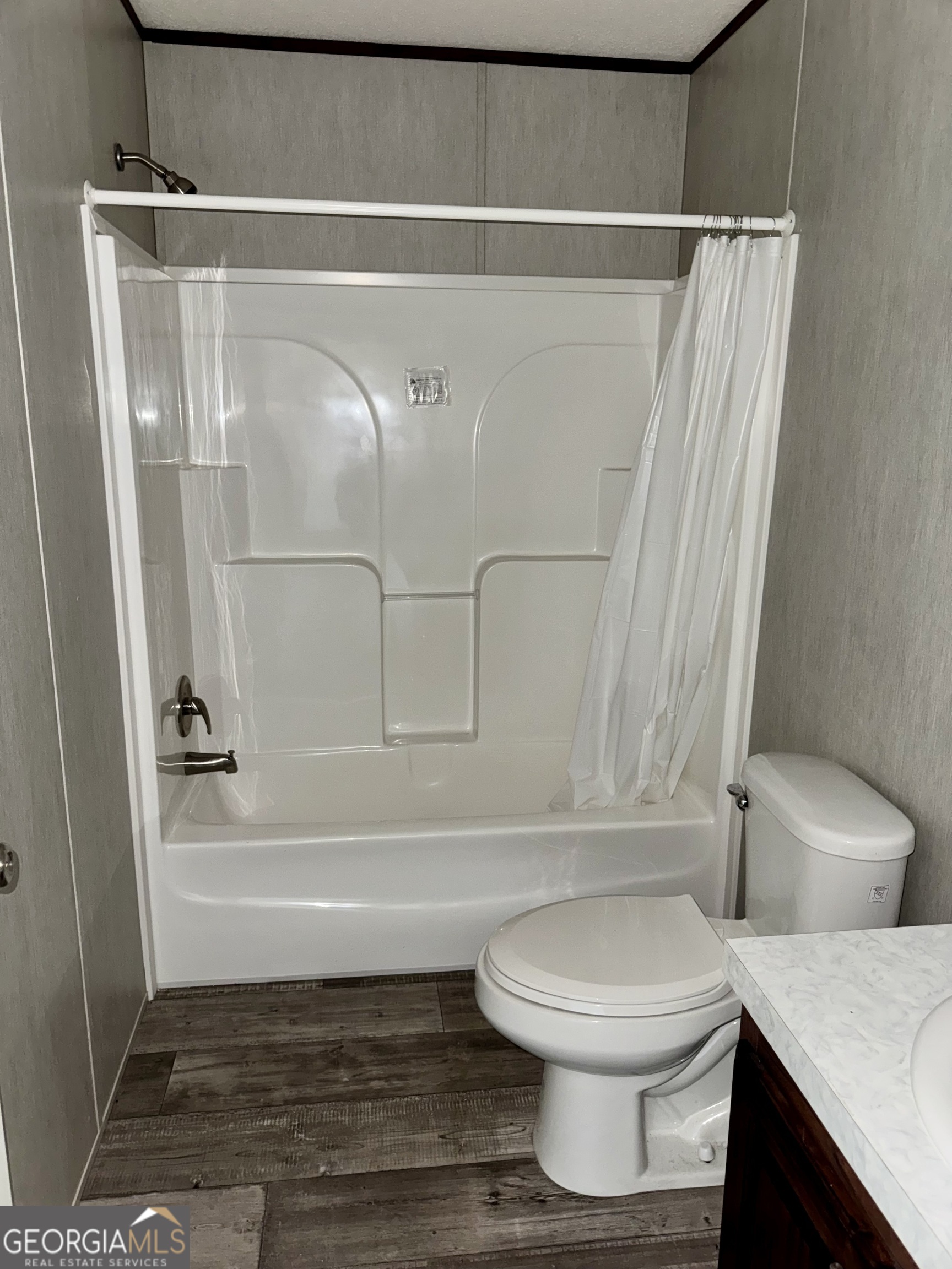 545 Ben Jackson Road Vidalia, GA 30474 - Photo 19 of 25 a bathroom with a toilet and a shower