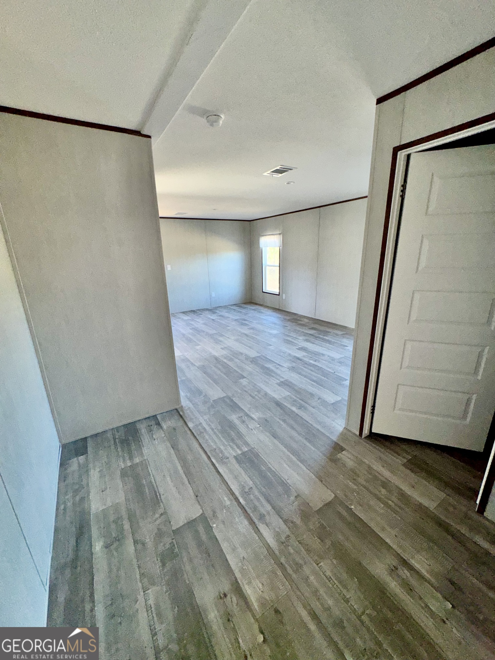 545 Ben Jackson Road Vidalia, GA 30474 - Photo 25 of 25 a view of empty room with wooden floor and fan