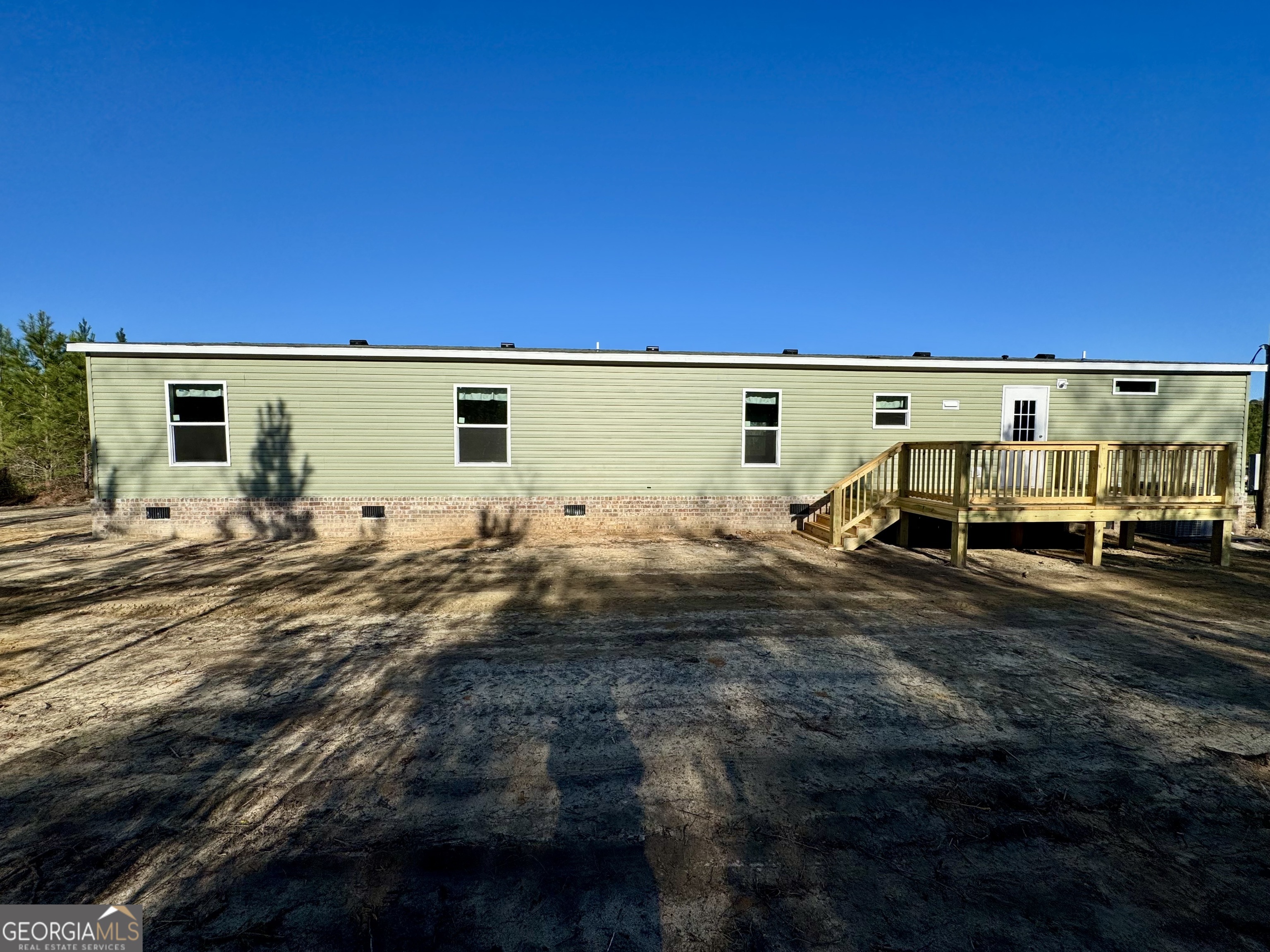 545 Ben Jackson Road Vidalia, GA 30474 - Photo 4 of 25 a view of back yard with wooden fence