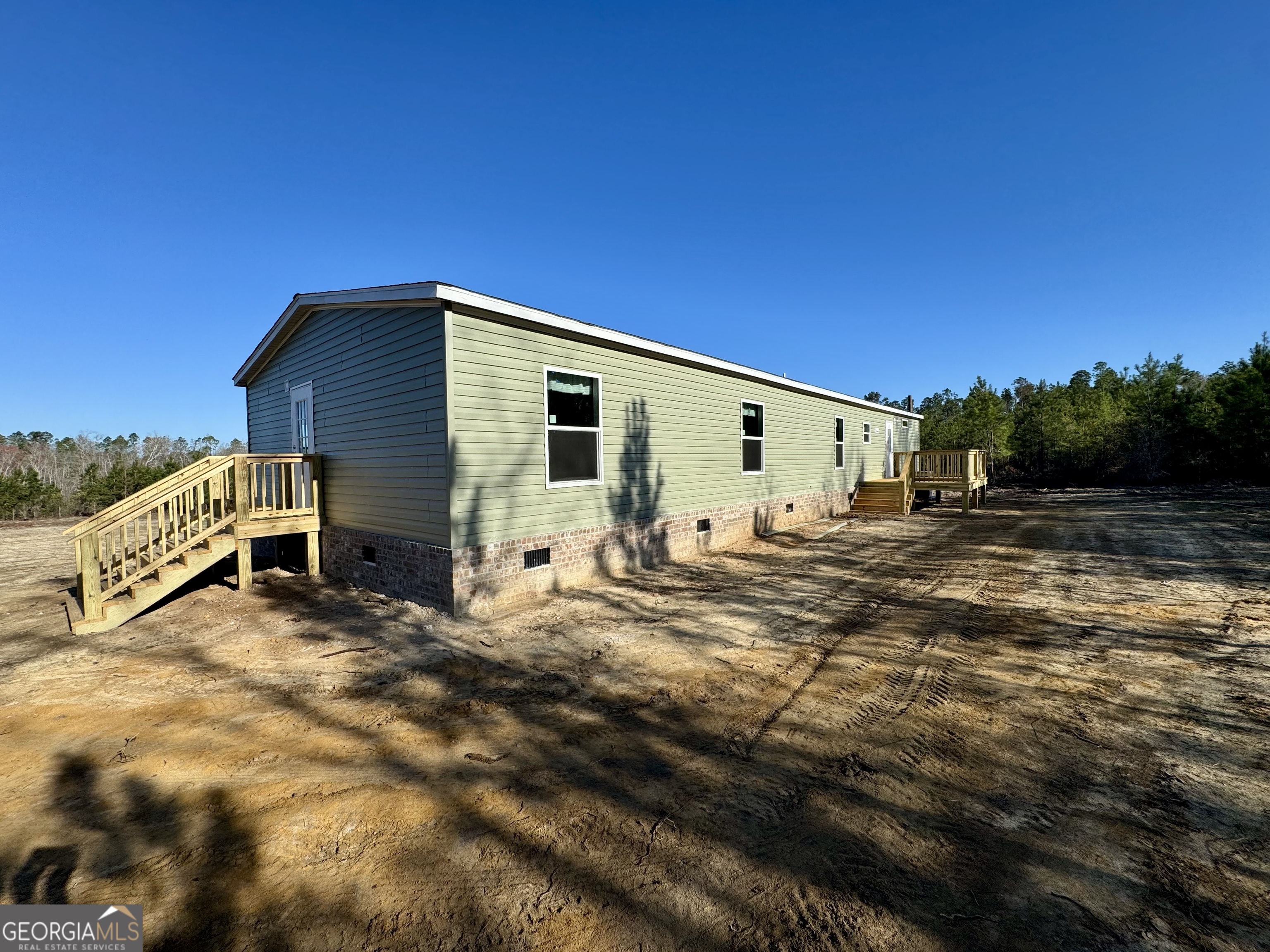 545 Ben Jackson Road Vidalia, GA 30474 - Photo 5 of 25 a view of a house with backyard