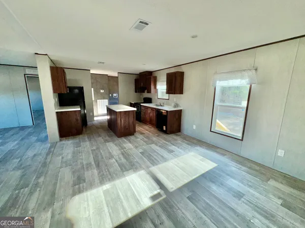 a view of living room with furniture and flat screen tv