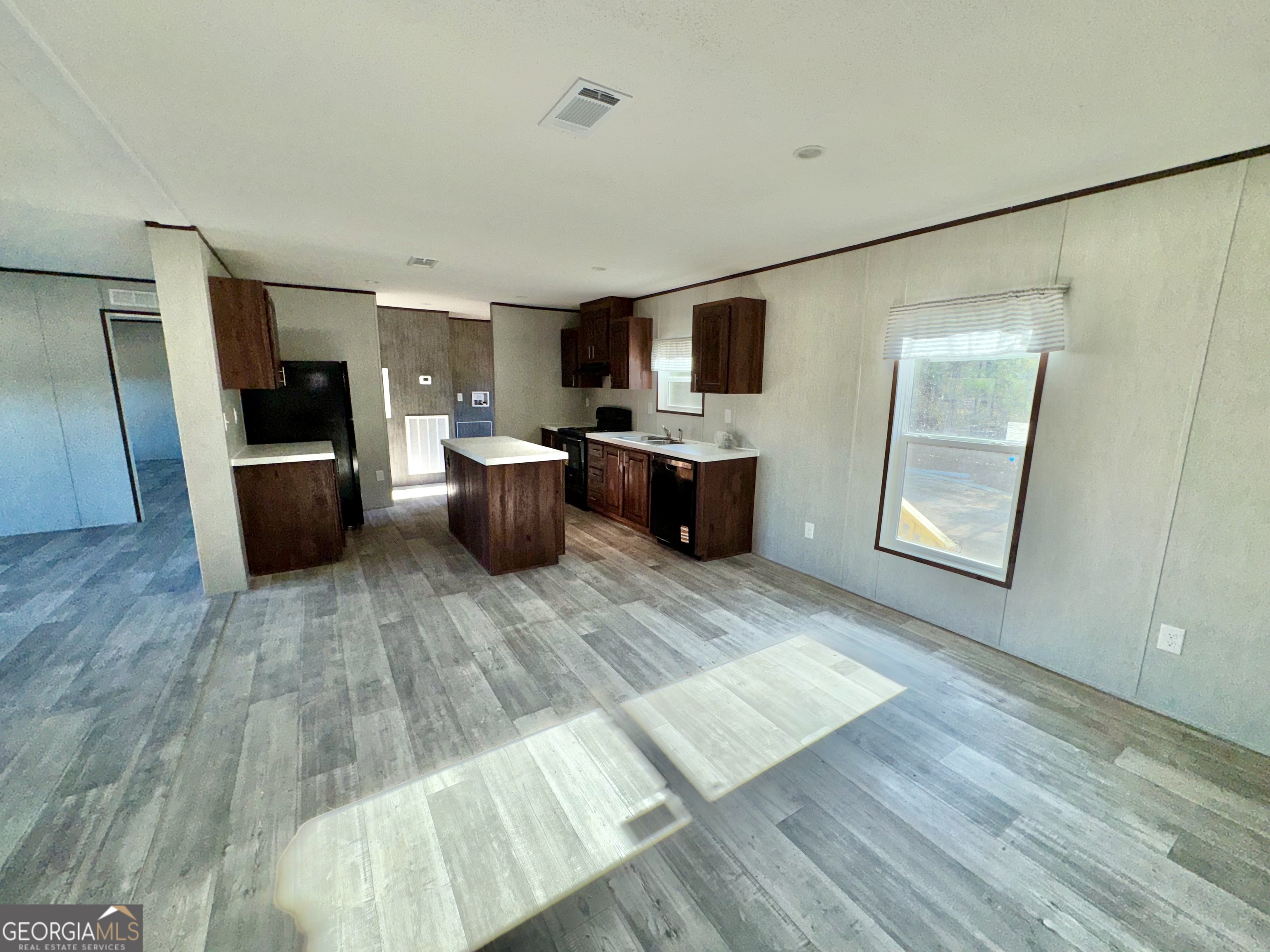 545 Ben Jackson Road Vidalia, GA 30474 - Photo 7 of 25 a view of living room with furniture and flat screen tv