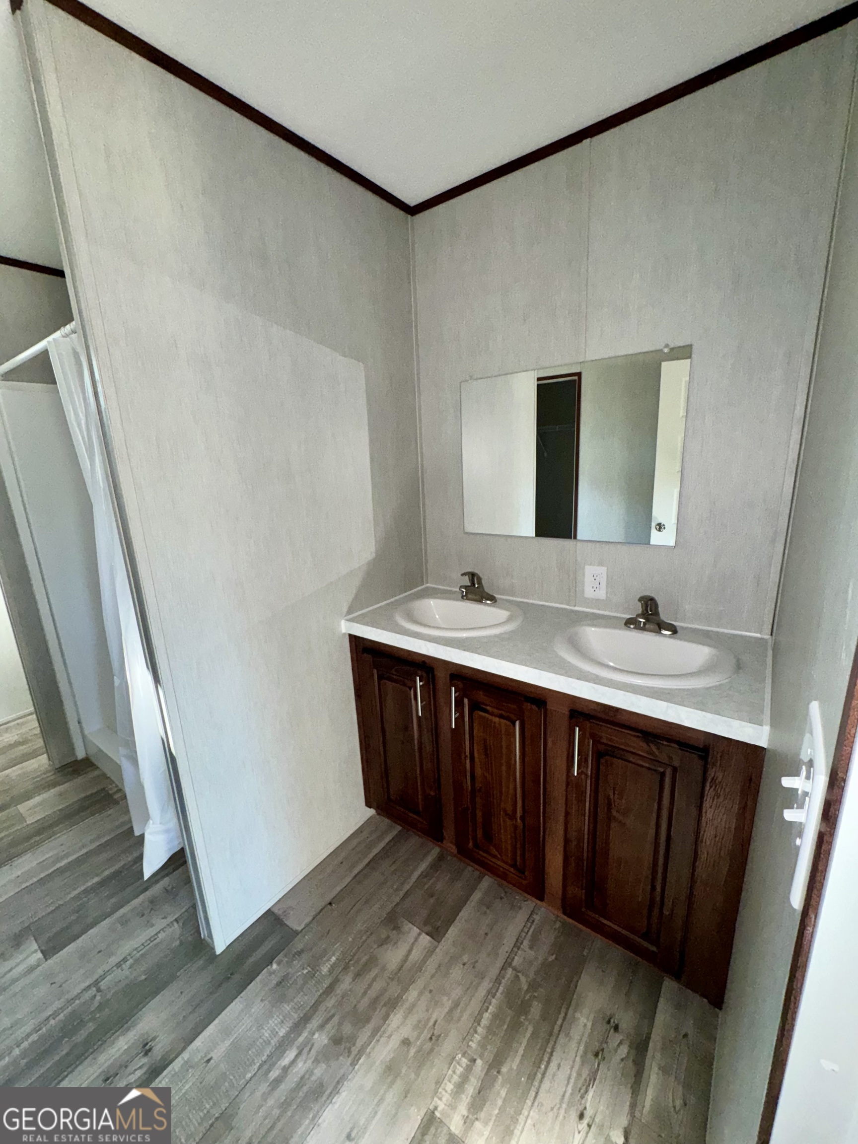 545 Ben Jackson Road Vidalia, GA 30474 - Photo 10 of 25 a bathroom with a sink and mirror