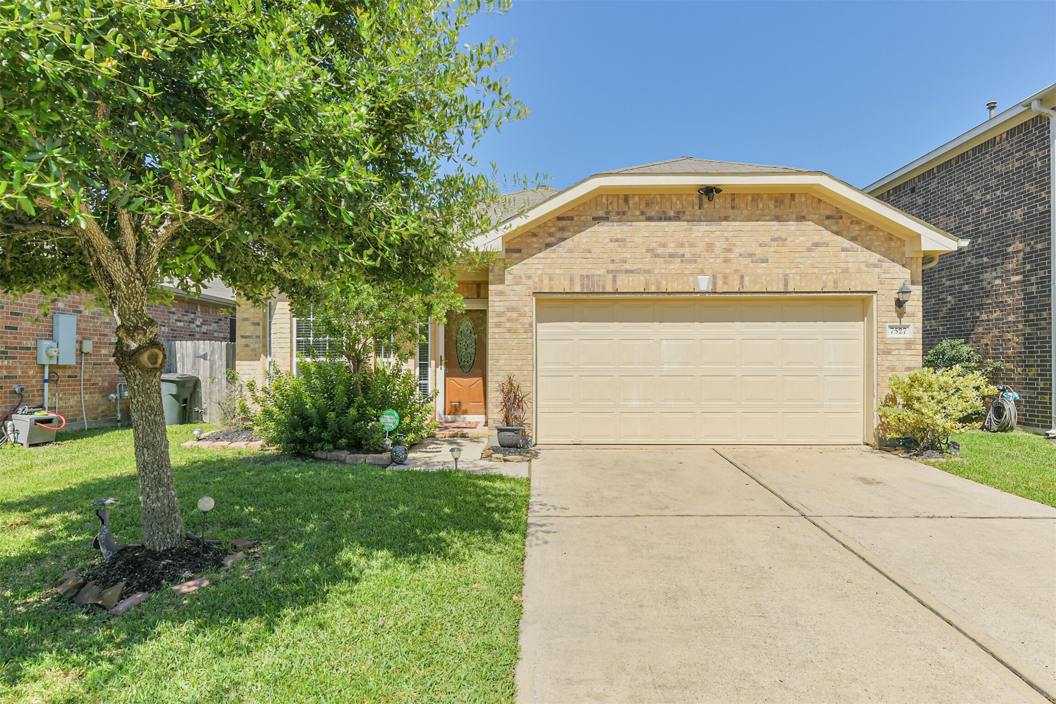 7527 Windsor Valley Lane Houston, TX 77049 - Photo 1 of 35 a view of a house with a yard