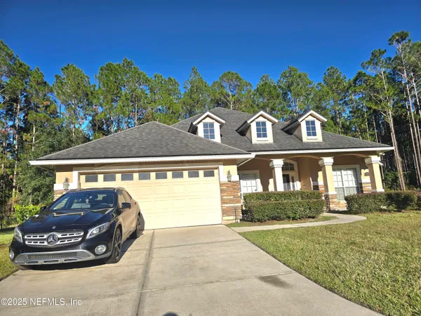 a front view of a house with a yard