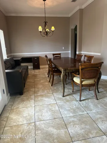 a kitchen with stainless steel appliances granite countertop a stove top oven a sink a counter top space and cabinets