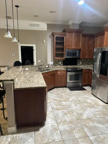 a bathroom with a double vanity sink toilet mirror and shower