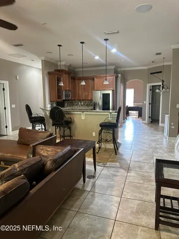 a view of yard with swimming pool and green space