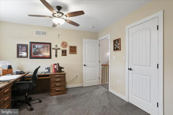 a view of a room with wooden walls