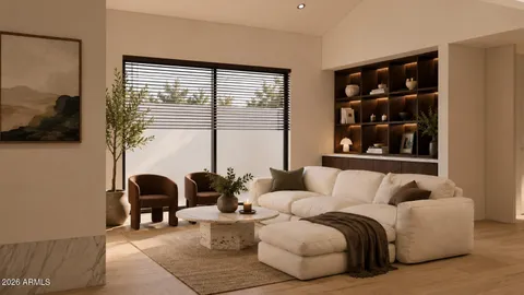 a living room with furniture and large windows