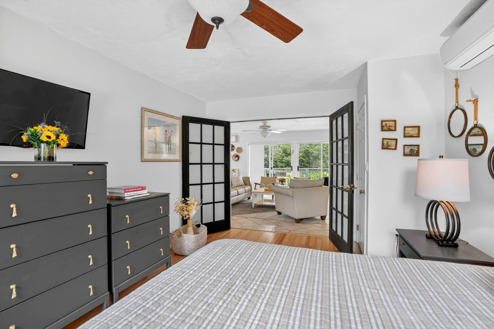 9 Thaxter Lane Edgartown, MA 02539 - Photo 38 of 53 a bedroom with a bed and a chandelier
