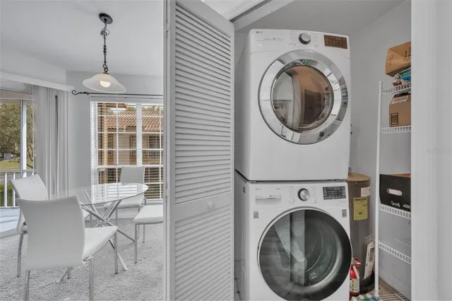 a view of a livingroom with washer and dryer